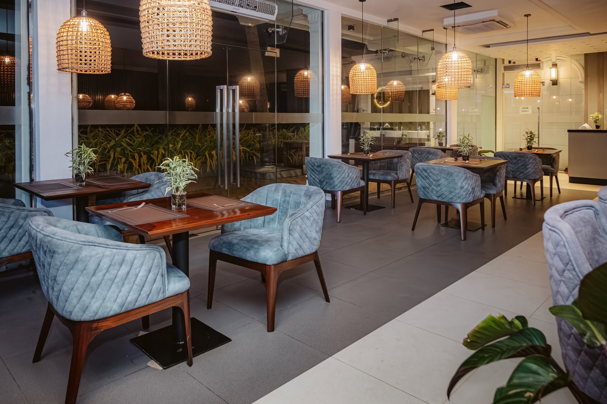 Warmly lit Madeena dining room in the evening